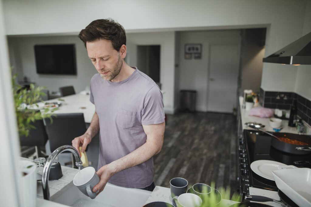 Homeowner washing dishes